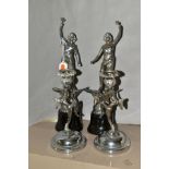 A PAIR OF ART DECO CHROME FIGURES, with a pair of Art Deco chrome candle holders, the chrome figures