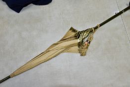 AN EDWARDIAN SILK PARASOL, cream silk canopy and green stained wooden shaft, approximate length