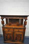 A REPRODUCTION OAK COURT CUPBOARD, canopy top with carved foliate front and single door, on