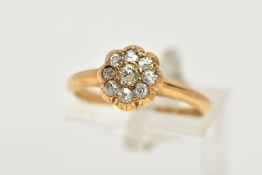 A YELLOW METAL DIAMOND FLOWER RING, flower design set with old cut diamonds, estimated total diamond