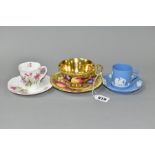 AN AYNSLEY ORCHARD GOLD TEA CUP AND SAUCER TOGETHER WITH TWO COFFEE CANS AND SAUCERS, the Orchard
