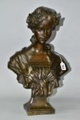 A PATINATED BRONZE BUST, young female with head bowed, garlands in hair and tied shawl over