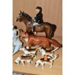 A BESWICK HUNTSWOMAN, HOUNDS AND FOX FIGURES, comprising Huntswoman on Brown Horse 1730 height 21cm,