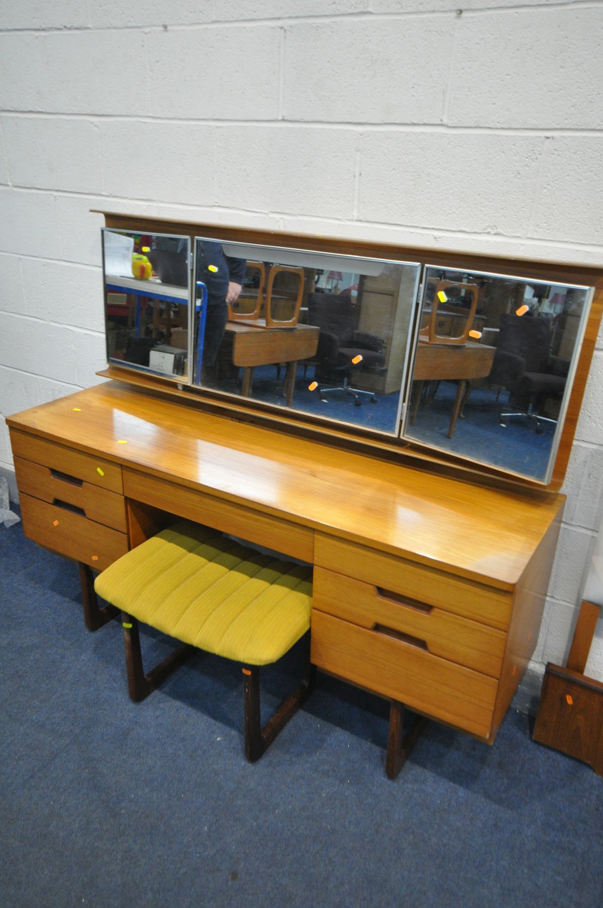 A UNIFLEX FIVE PIECE TEAK DRESSING TABLE, with a plywood back enclosing triple mirrors and seven - Image 2 of 7