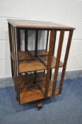 AN EARLY TO MID 20TH CENTURY OAK TWO TIER REVOLVING BOOKCASE, 46cm square x height 82cm (good