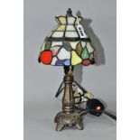 A MODERN BEDSIDE LAMP WITH A LEADED GLASS SHADE, cast metal base, overall height 32cm