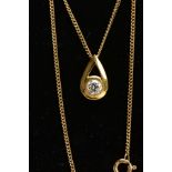 A 9CT GOLD DIAMOND NECKLACE, a pear shaped yellow gold pendant set with a round brilliant cut