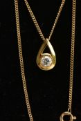 A 9CT GOLD DIAMOND NECKLACE, a pear shaped yellow gold pendant set with a round brilliant cut
