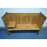 A PITCH PINE PEW, later added shelf, length 131cm x depth 43cm x height 91cm (condition - general