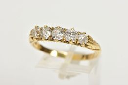 A YELLOW METAL FIVE STONE DIAMOND RING, designed with a row of five old cut diamonds, estimated