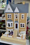 A LARGE MODERN WOODEN DOLLS HOUSE, modelled as a two storey Georgian style house with basement and