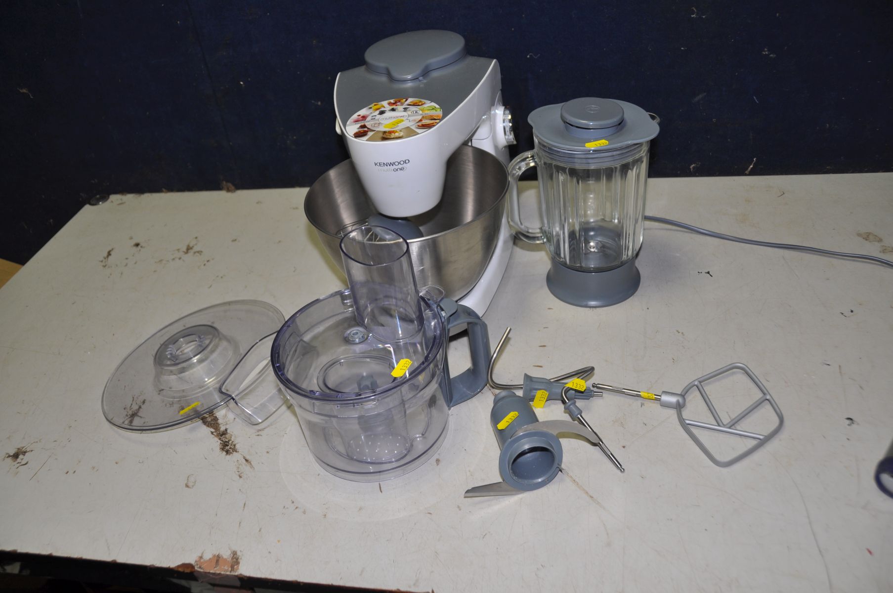 A KENWOOD MULTIONE FOOD PROCESSOR with attachments