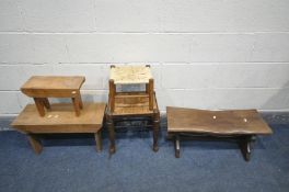 FIVE VARIOUS STOOLS, to include two sized pine trestle stools with trestle legs, largest length 61cm