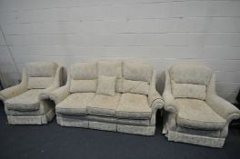 A CREAM AND FLORAL UPHOLSTERED THREE PIECE LOUNGE SUITE, comprising a three seater sofa, length