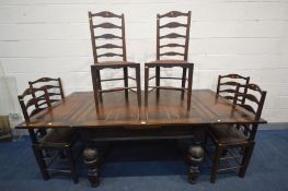 AN EARLY 20TH CENTURY OAK DRAW LEAF TABLE, on acorn supports united by a shaped H stretcher on bun