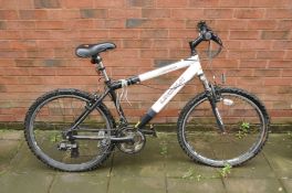 A LINCOLN MARCH MOUNTAIN BIKE with 21 speed Shimano gears, 17in frame and front suspension