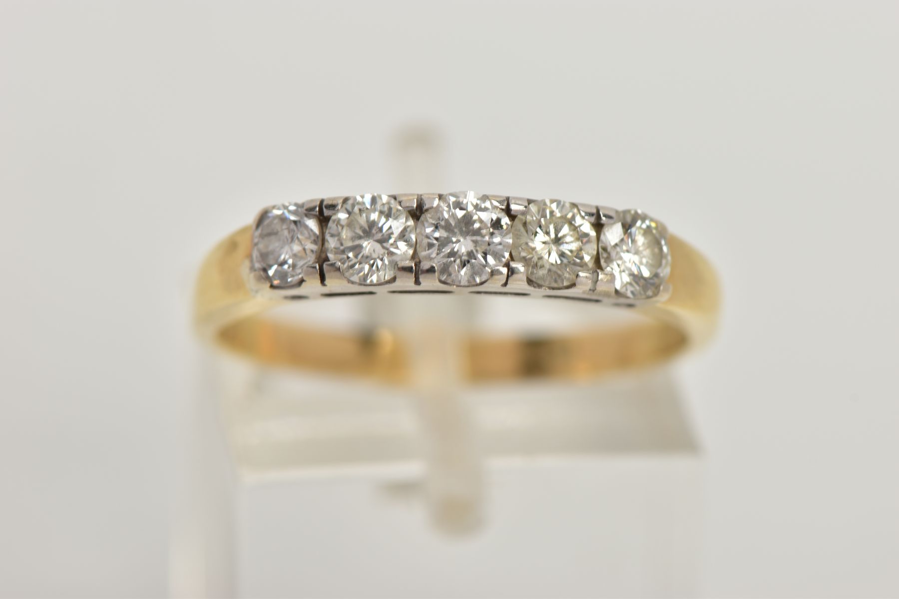 A YELLOW METAL FIVE STONE DIAMOND RING, set with five slightly graduating round brilliant cut - Image 5 of 5