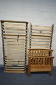 AN OAK SINGLE BEDSTEAD with pull out folding bed (condition:-fluid stains to head and footboard,