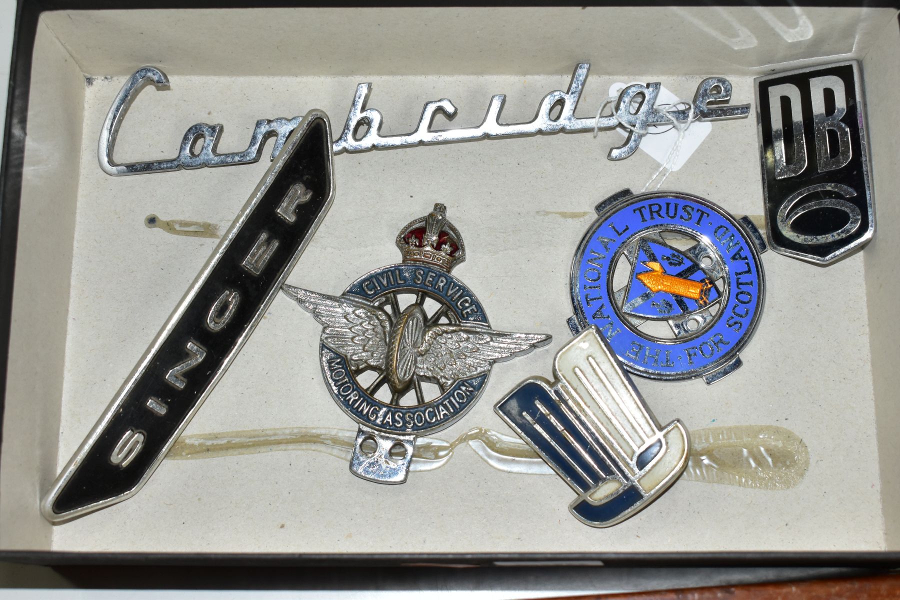 VINTAGE CAR BADGES / EMBLEMS ETC, comprising an Aston Martin DB6 chrome and enamel badge (small chip