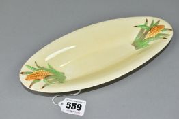 A CLARICE CLIFF FOR NEWPORT POTTERY 'CORN COB' DISH, of oval form, length 25cm, width 11cm, with