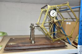 A VICTORIAN BRASS YARN WINDER, the enamel recording gauge dial inscribed John Nesbit, 42 Market