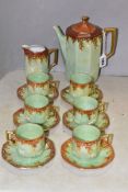 A 1920S RUDOLPH WACHTER GREEN AND ORANGE LUSTRE OCTAGONAL FOURTEEN PIECE PORCELAIN COFFEE SET,