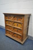A REPRODUCTION JACOBEAN STYLE CHEST OF FOUR LONG DRAWERS, width 84cm x depth 49cm x height 92cm (