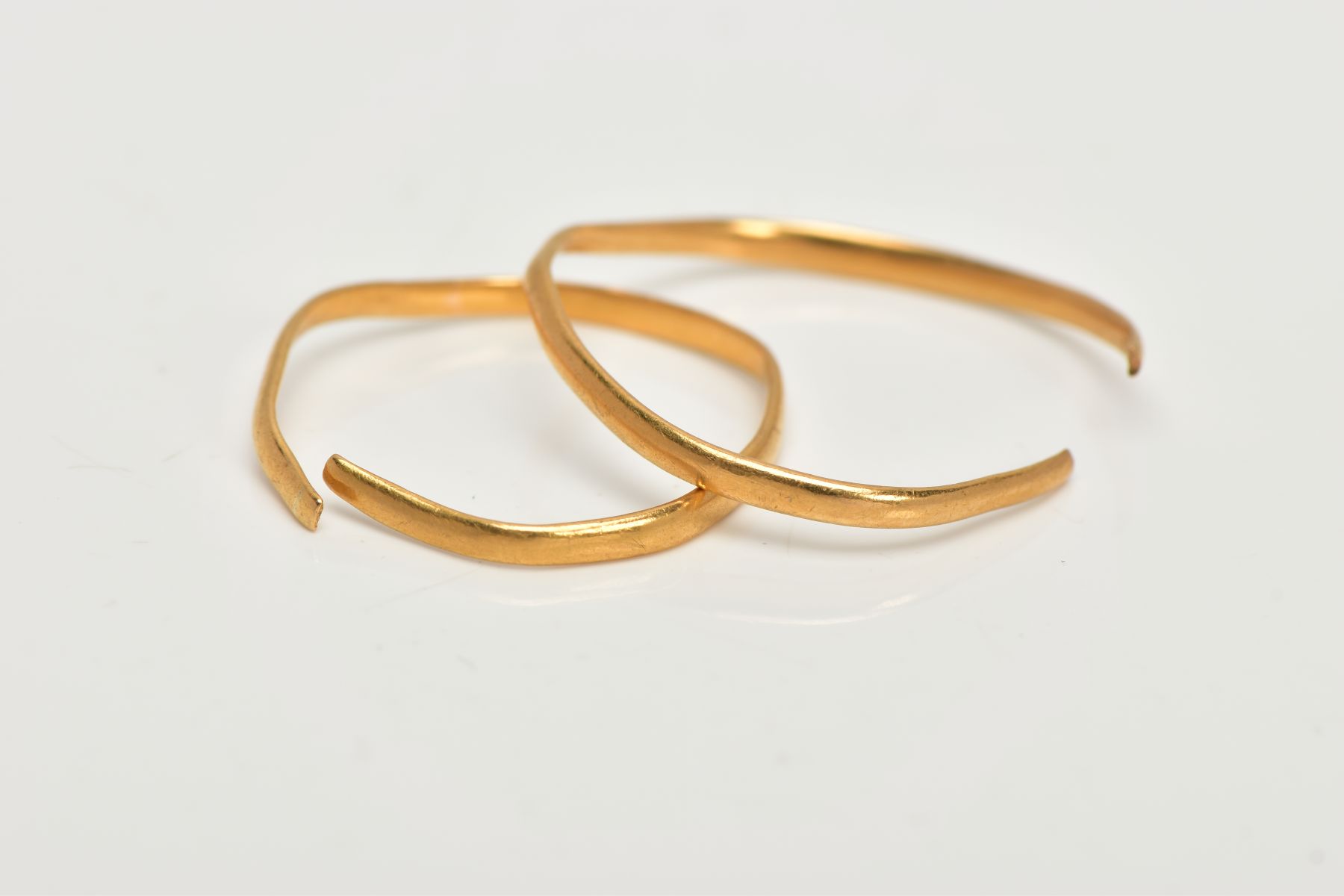 TWO AF THIN GOLD BAND RINGS, the first a thin band ring, with a split shank hallmarked 22ct