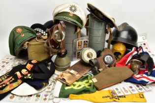 A BOX CONTAINING VARIOUS MILITARY & CIVIL HEADWEAR, plus other Military items, flags etc include two