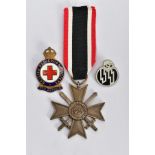 A GERMAN WORLD WAR TWO WAR MERIT CROSS WITH SWORDS, in bronze, the ring suspender is marked with the