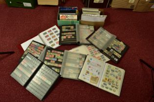 WORLDWIDE COLLECTION OF STAMPS in eight albums and some later GB presentation packs, often empty but