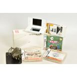 A WHITE DS LITE, complete with box, charger, starter pack, More Brain Training From Doctor Kawashima