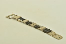 A LATE VICTORIAN BANDED AGATE BUCKLE BRACELET, designed as a series of scroll engraved links,