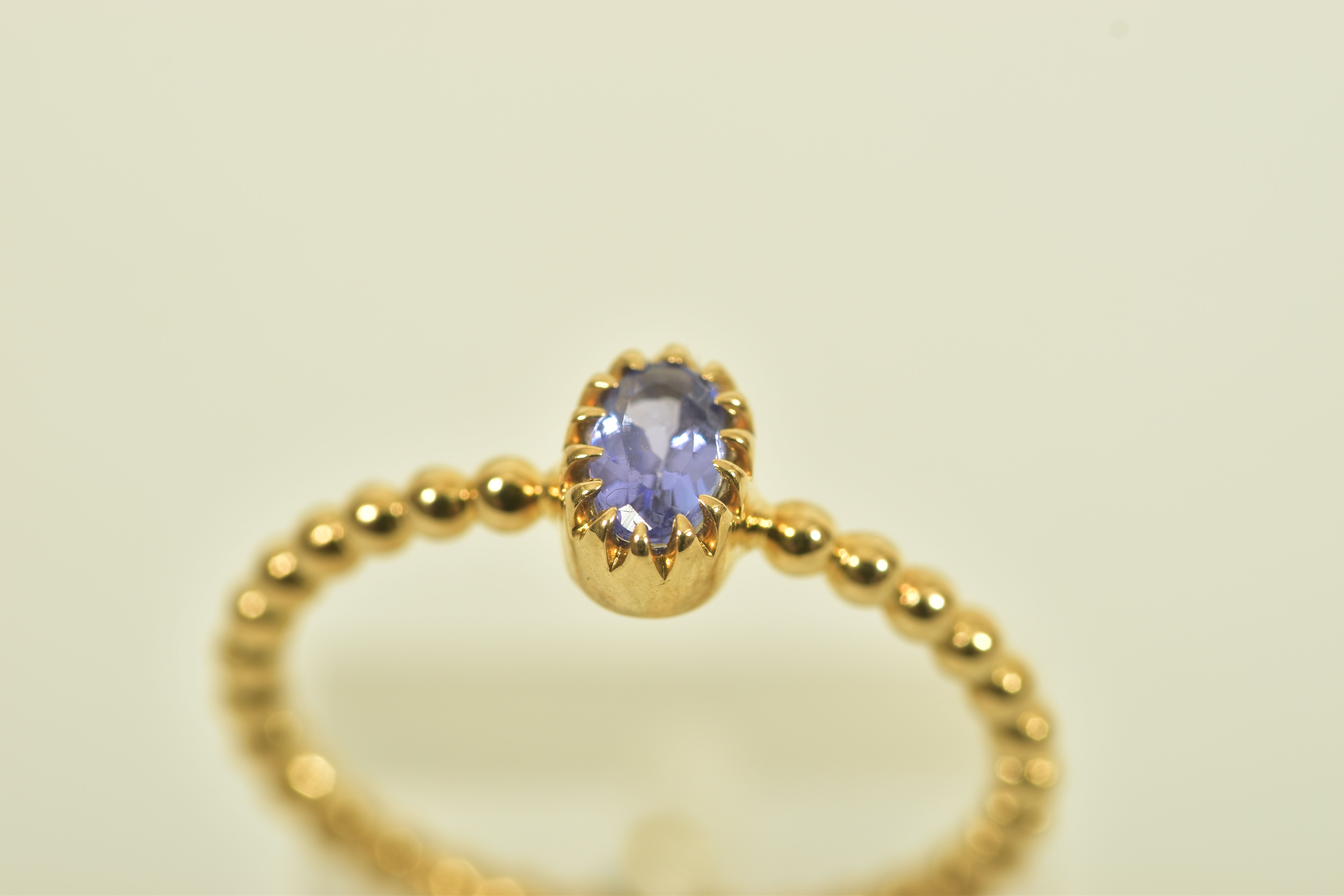 A 9CT GOLD TANZANITE SINGLE STONE RING, the oval shape tanzanite, to the bead detail band, - Image 4 of 6