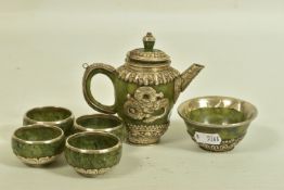 A JADE AND WHITE METAL TEA SET, of decorative oriental design, to include a tea pot with lid and