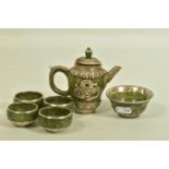 A JADE AND WHITE METAL TEA SET, of decorative oriental design, to include a tea pot with lid and