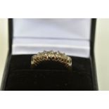 AN OLD CUT DIAMOND DRESS RING, the graduated old cut diamond rows, with openwork gallery and tapered