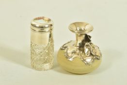 TWO GLASS SCENT BOTTLES, the first an Edwardian silver and moulded textured glass cylinder with