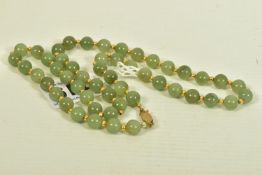 A JADE BEAD NECKLACE, comprising of fifty one spherical jade beads, with yellow metal spacers and