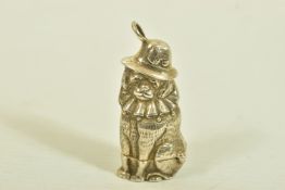 A NOVELTY DOG VESTA CASE, with hinged base, depicting a large seated dog wearing a hat and collar,