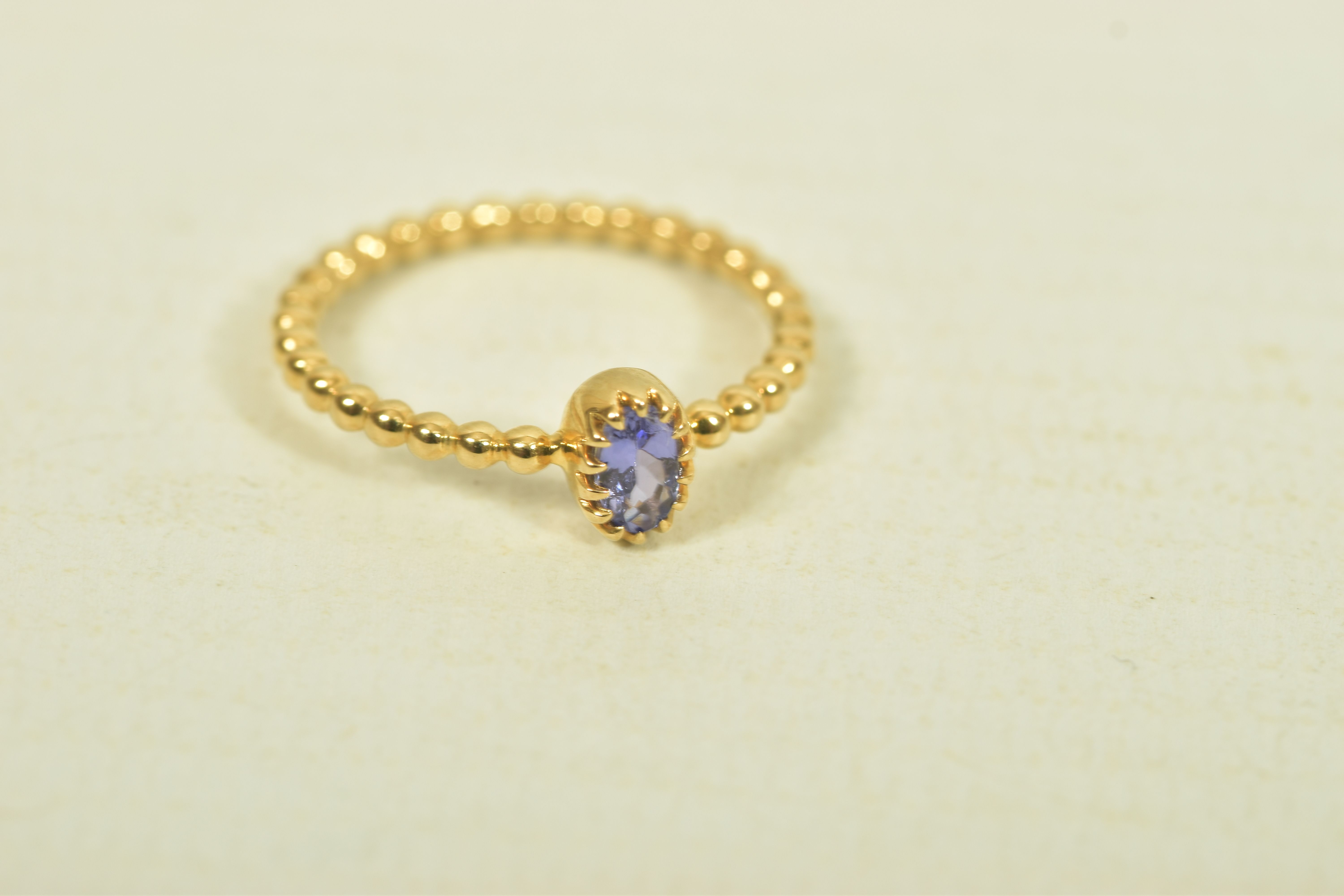 A 9CT GOLD TANZANITE SINGLE STONE RING, the oval shape tanzanite, to the bead detail band, - Image 6 of 6