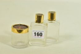 A SET OF THREE EARLY 20TH CENTURY GUILTED SILVER AND TORTOISESHELL GLASS BOTTLES, each hallmarked