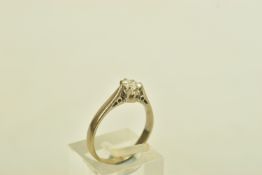AN 18CT WHITE GOLD DIAMOND SINGLE STONE RING, the circular cut diamond, claw set, with tapered band,