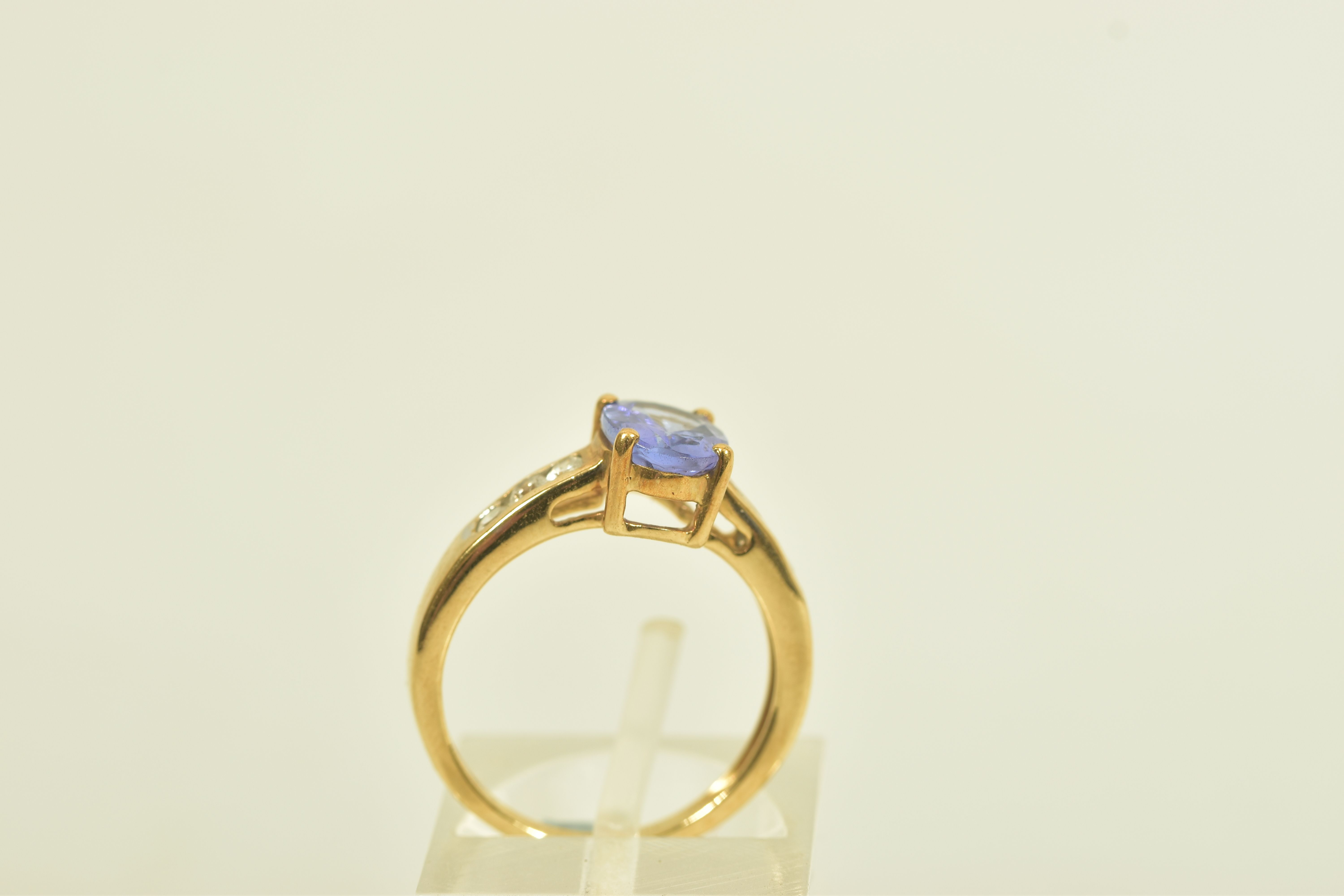 A 9CT GOLD TANZANITE AND COLOURLESS GEM DRESS RING, the oval tanzanite, to the circular colourless - Image 3 of 6