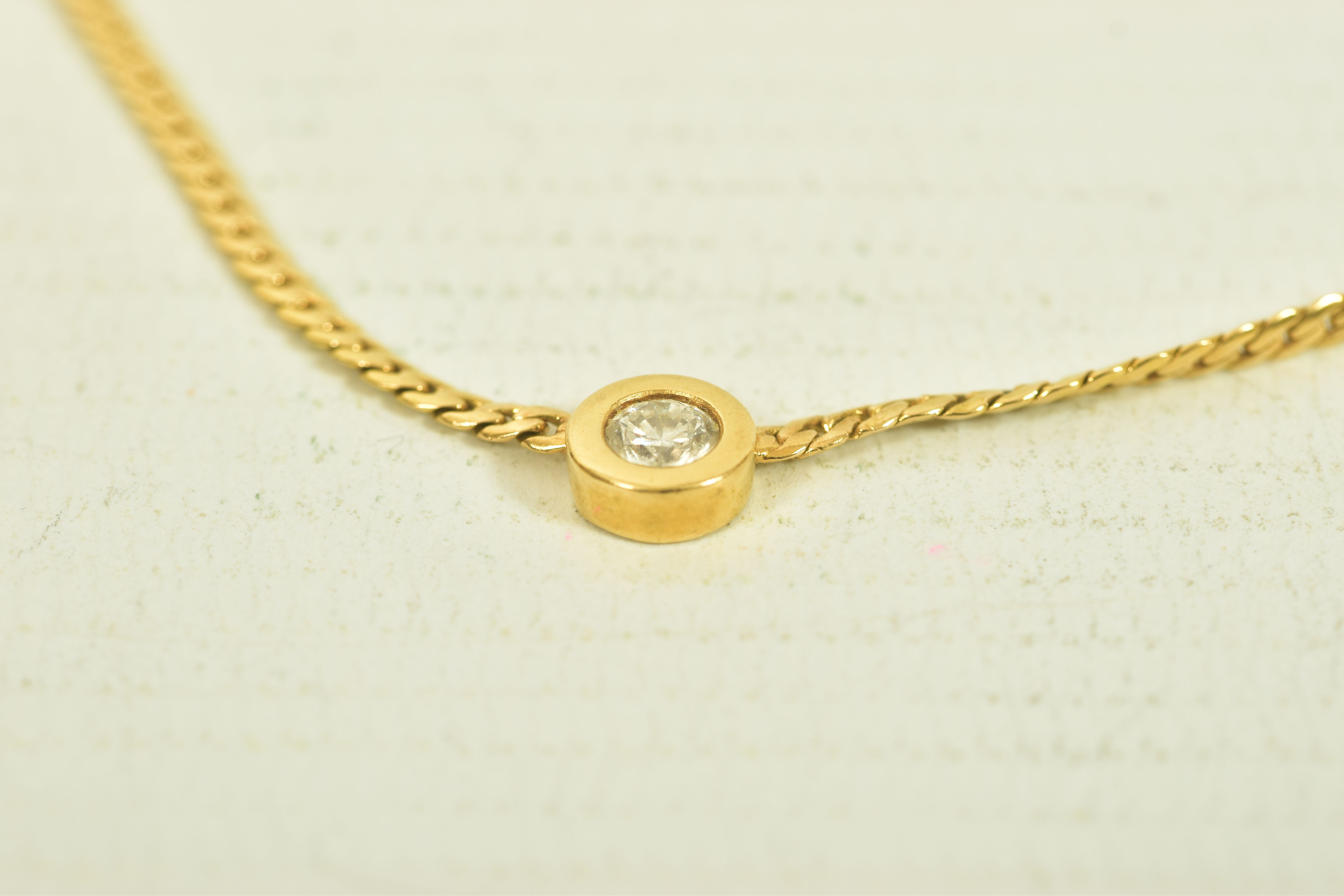 A YELLOW METAL DIAMOND PENDANT WITH FLAT LINK CHAIN, a single round brilliant cut diamond, estimated - Image 2 of 5