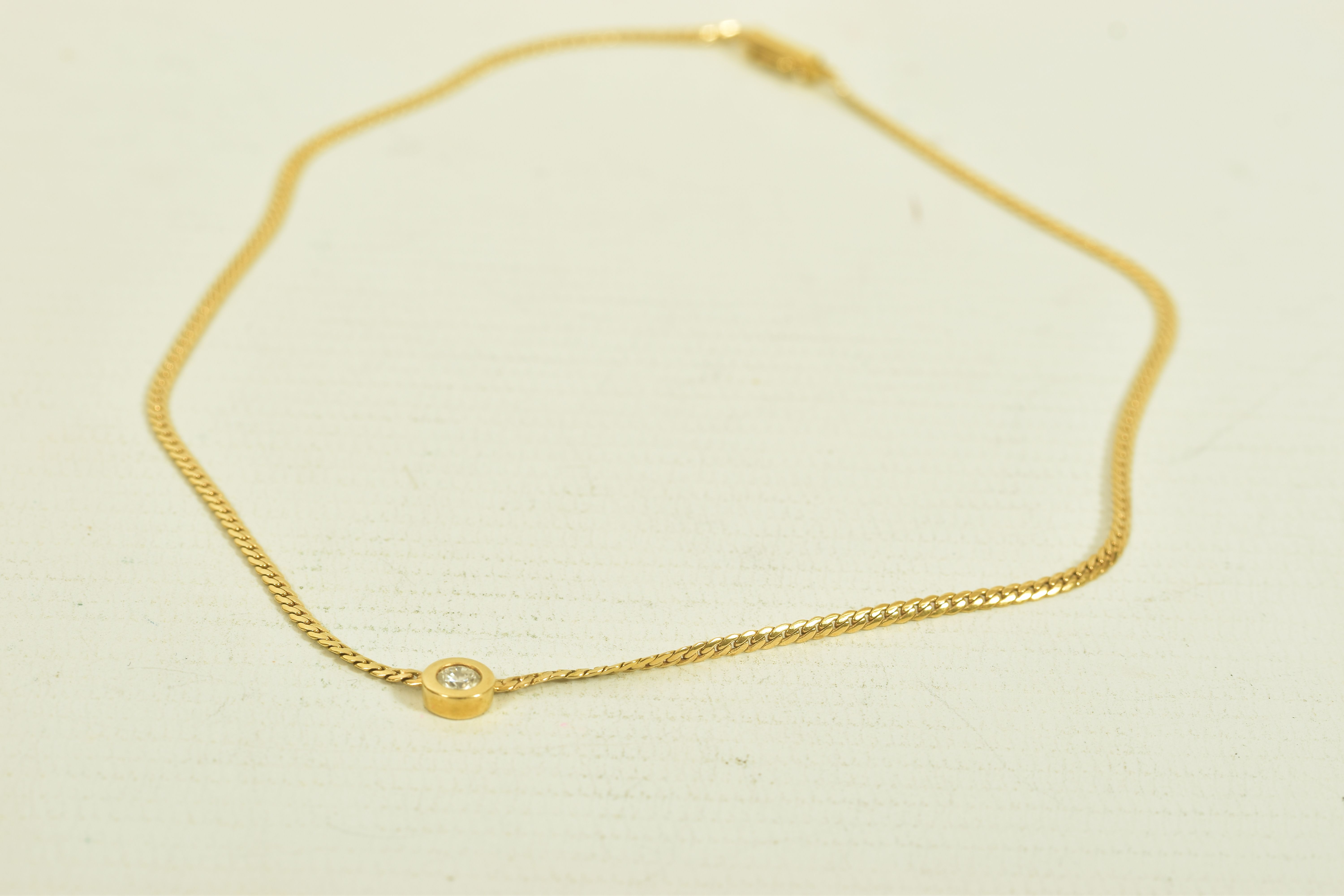 A YELLOW METAL DIAMOND PENDANT WITH FLAT LINK CHAIN, a single round brilliant cut diamond, estimated - Image 3 of 5