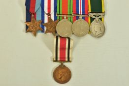 A GROUP OF FIVE MEDALS ON A WEARING BAR AS FOLLOWS, 1939-45, France & Germany Stars, Defence & War