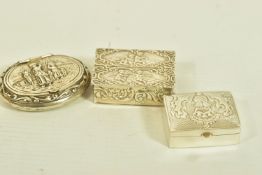 THREE SILVER SNUFF BOXES, to include a 1970s snuff box with cherub and scroll embossed detail,