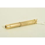 A 9CT GOLD RETRACTABLE TOOTHPICK, engine turned design, hallmarked 9ct Birmingham 2008, measuring