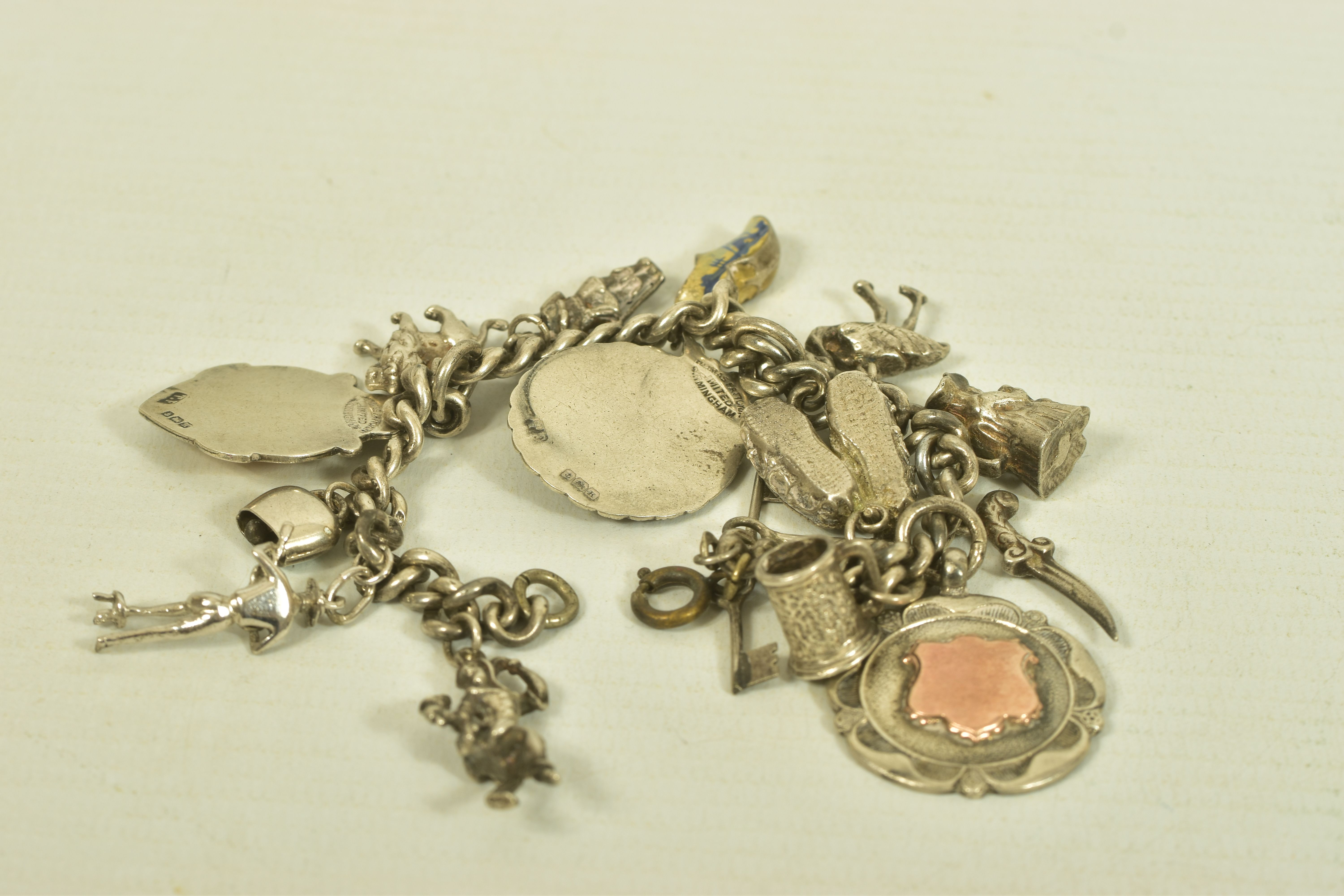 TWO MID 20TH CENTURY SILVER CHARM BRACELETS, the first comprising two cricket and football - Image 7 of 11